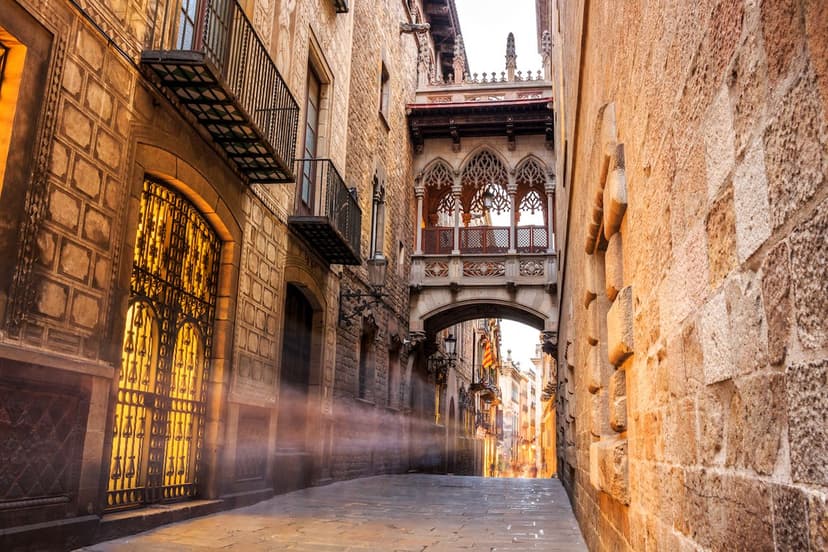 Narrow medieval alley bathed in morning light, Barri Gòtic