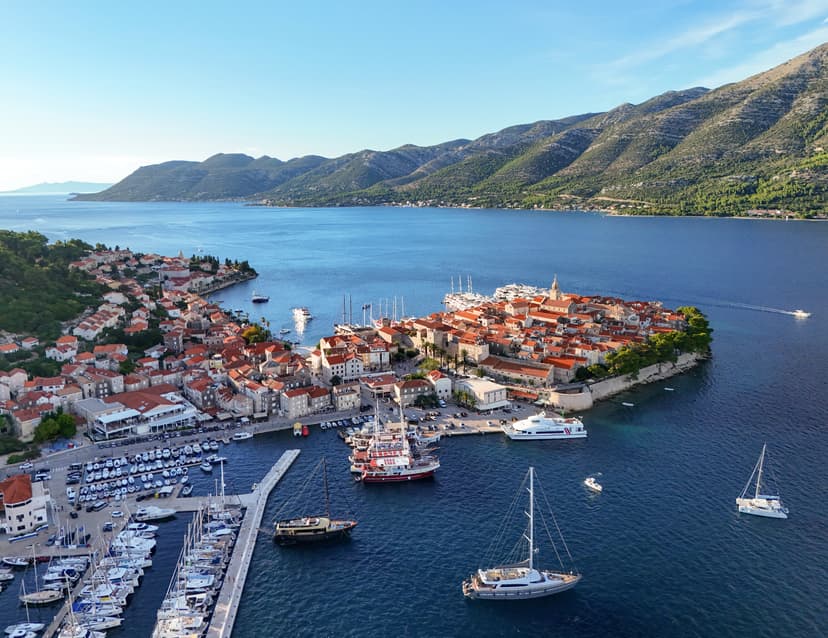 Korčula old town on its peninsula facing the Pelješac channel, aerial view