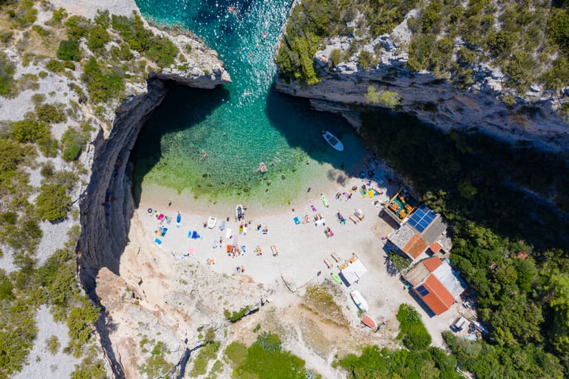 White pebbles and emerald water of Stiniva cove between its cliffs, Vis island
