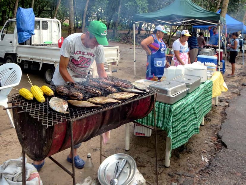 Fish and corn on a barbecue at the Bazar Labrin street market, Beau Vallon, Mahé