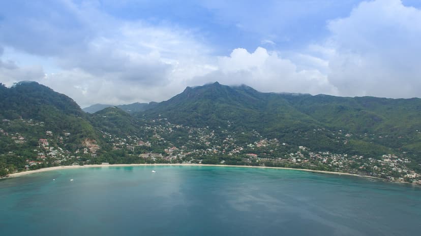 Aerial view of Beau Vallon bay beneath the Morne Seychellois mountains, Mahé
