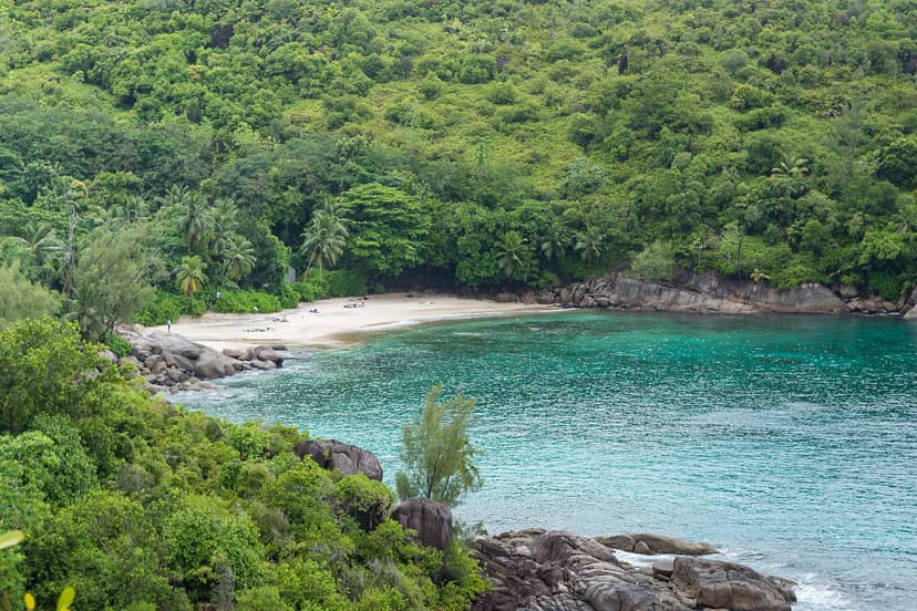 Secluded Anse Major cove between forest and granite boulders, seen from the coastal trail, north-west Mahé