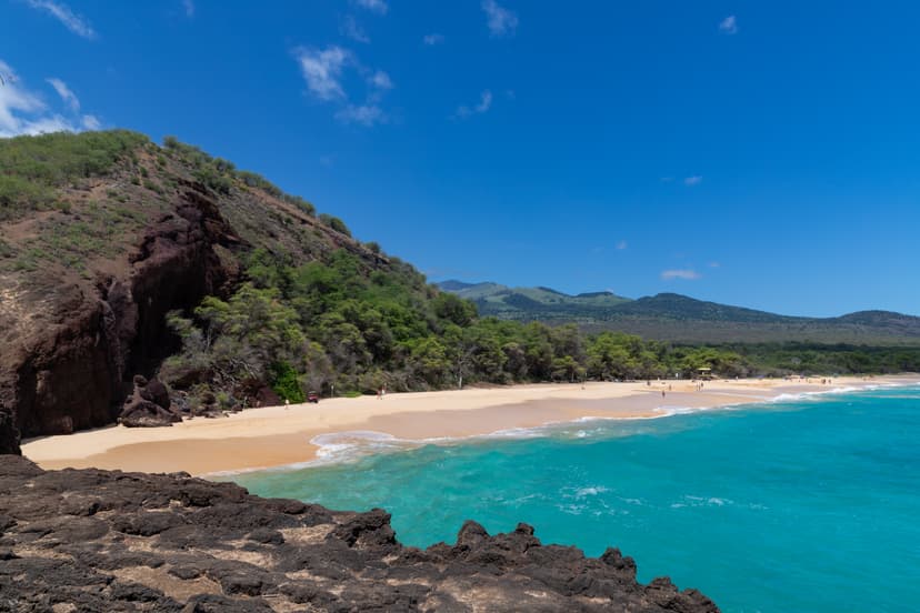 Wide undeveloped golden sand of Mākena Beach, known as Big Beach, south Maui